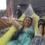 Tiki relaxing in a hammock at the music festival